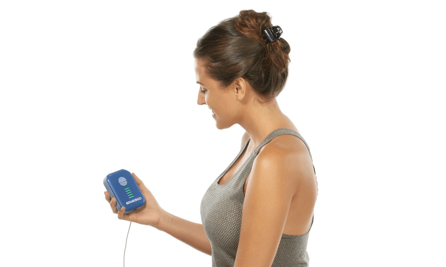A young woman holding the BioWaveGO pain therapy device. 